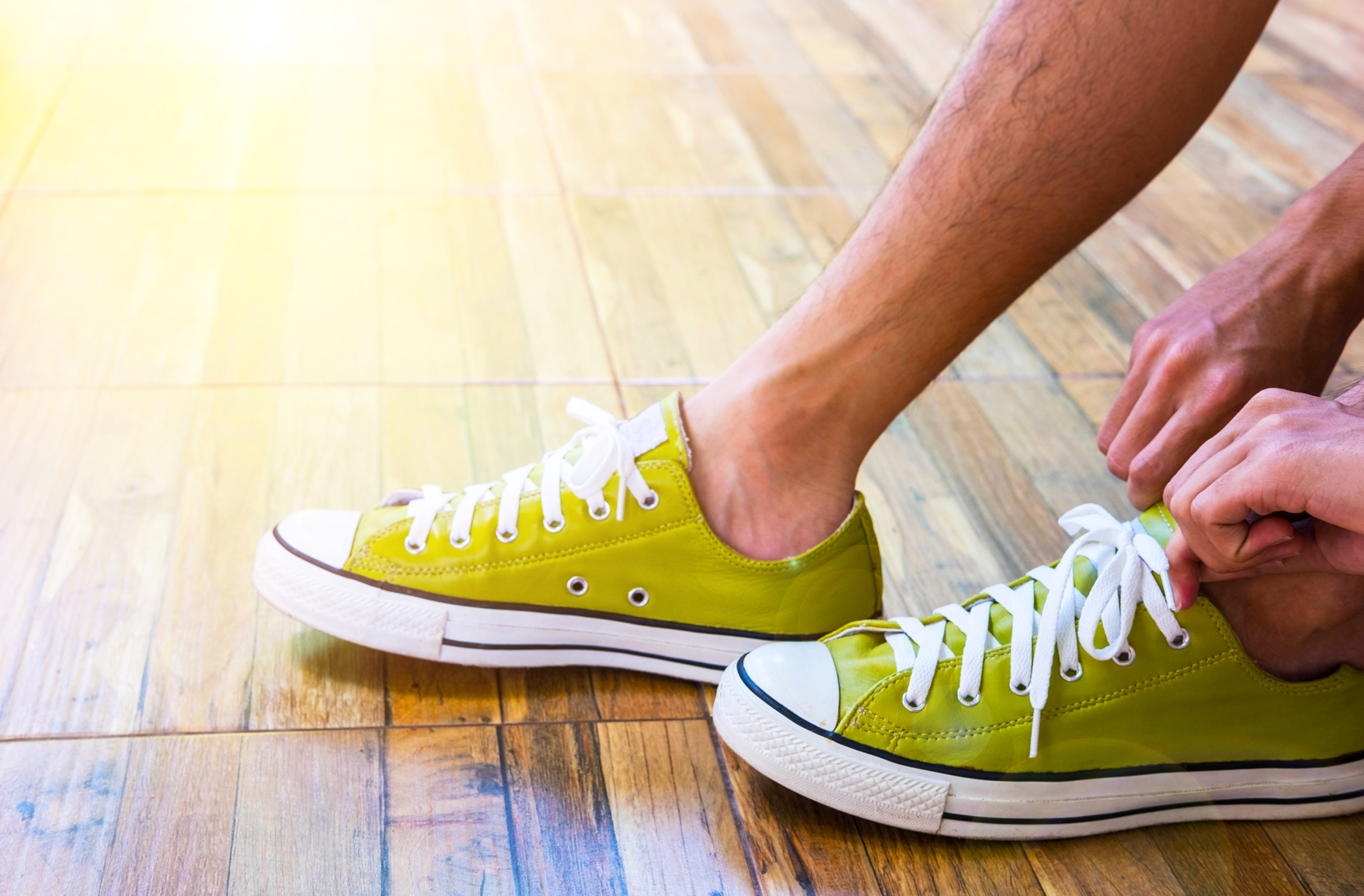 Teenager boy wear lemon green leather sneaker , flare effect